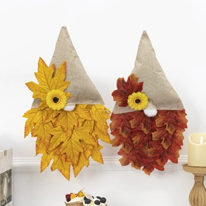 Pair of autumn Thanksgiving gnomes with maple leaves and sunflowers for wall decor
