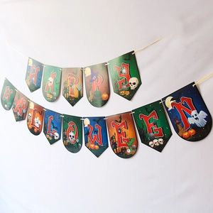 Detail of Happy Halloween colorful paper bunting banner with festive spooky illustrations