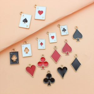 DIY playing card charms in gold alloy with red and black enamel drips for jewelry making