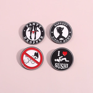 Set of four unique enamel pins in black, white, and red on a soft pink background