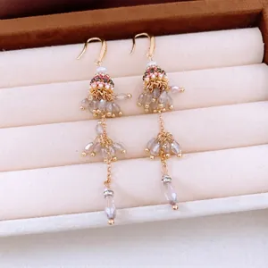 Ethnic glass beaded tassel earrings with grey crystal pendants and gold hooks