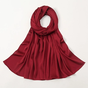 Deep red satin hijab scarf with textured bubble finish and elegant drape on white background
