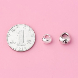 Solid S925 sterling silver charms with Fu character next to a coin for size reference