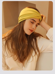 Close-up of a soft yellow headband on a model, showing comfort for sleeping and daily use
