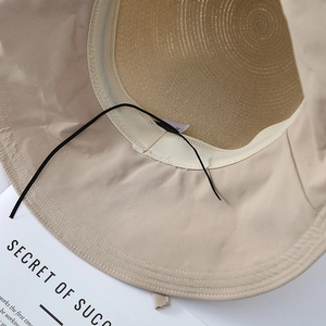 Bow tie straw sun hat for women featuring contrast fabric brim and adjustable wind rope