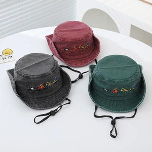 Detail of kids bucket hats with construction truck embroidery and adjustable chin straps