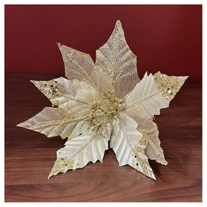 Detail of champagne gold Christmas flower decoration with glitter lace petals