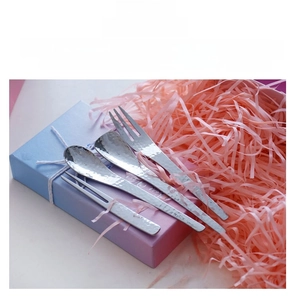 Close-up of Japanese style hammered stainless steel cutlery set on a gift box