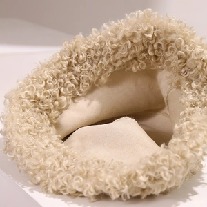 Chic beige fuzzy bucket hat with warm curly faux fur texture and windproof design