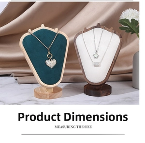 Detailed view of luxury velvet necklace display busts with elegant jewelry on silk