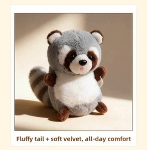 Detail of plush raccoon keychain featuring soft faux fur and a fluffy striped tail