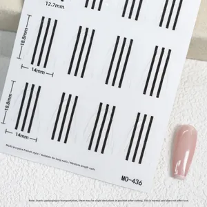 Macro view of French manicure guide stickers for long nails with size markings