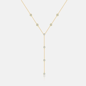 Macro shot of gold S925 sterling silver tassel necklace with sparkling round cubic zirconia