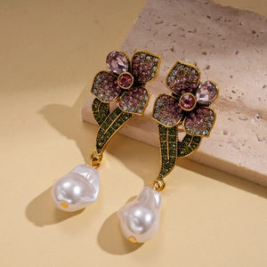 Detailed macro view of vintage flower earrings with rhinestones and baroque pearls