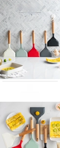 Close-up of heat-resistant silicone spatula with ergonomic beech wood handle and hanging loop