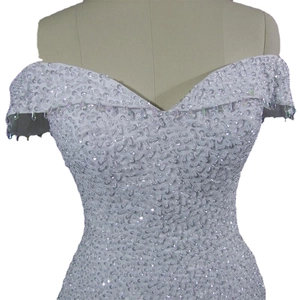 Elegant off-shoulder mermaid wedding dress with sparkling sequins and bead strings