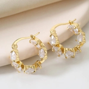 Elegant gold hoop earrings with marquise-cut heart zircons and polished finish