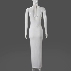 Detailed back view of a white halter neck backless maxi dress with fine knit texture