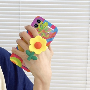 Detail of colorful floral phone case with integrated 3D flower stand and clear wrist strap