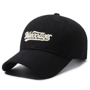 Black cotton baseball cap with Misootiger embroidery and curved brim in studio shot