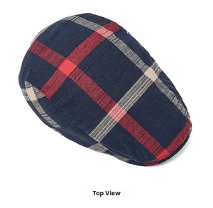 Top view of deep blue plaid ivy cap showing red and beige woven texture pattern
