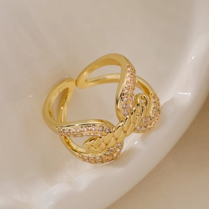 18K gold plated double spiral open ring featuring pink cubic zirconia stones