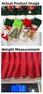 Macro detail of a 60g Christmas stocking showing Santa Claus and reindeer embroidery