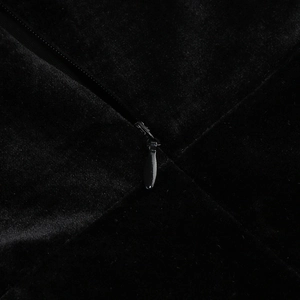 Detailed macro view of high-quality black velvet fabric with invisible zipper on dress