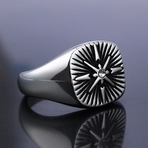 Vintage stainless steel compass ring for men featuring central zircon and radial sunburst engraving
