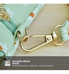 Detail of durable gold metal lobster clasp on a light green daisy print fabric bag