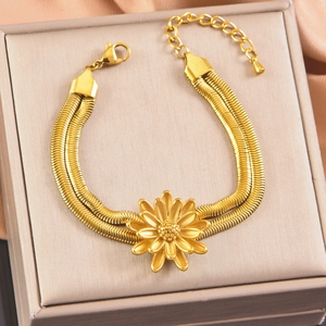 Golden double layer snake chain bracelet with sunflower pendant and pearl details