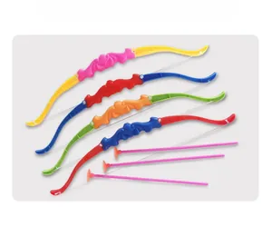 Detail of four colorful plastic toy bows and suction cup arrows for kids shooting sets