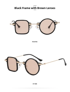 Detail of asymmetric black frames with brown lenses and golden metal bridge and temples