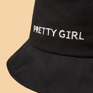 Fashionable black cotton bucket hat with white PRETTY GIRL embroidery for sun protection