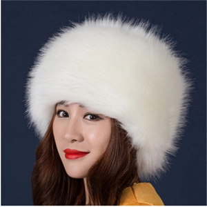 Close-up of white faux fox fur hat in Russian Cossack style for winter warmth