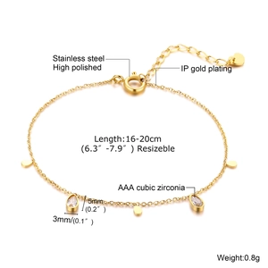 Detail of adjustable gold stainless steel bracelet with green cubic zirconia stone