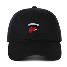 Detail of black cotton baseball cap with red tongue embroidery and punk style stitching