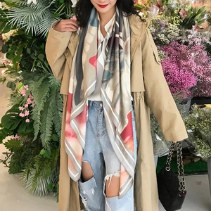 Detail of a large 130cm floral oil painting style scarf with silky texture and draped look