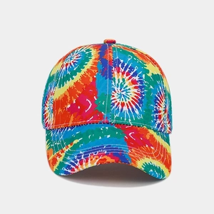 Close-up of vibrant rainbow tie-dye pattern on six-panel cotton baseball cap fabric