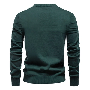 Detail view of dark green men's sweater back with unique pleated sleeves and ribbed texture