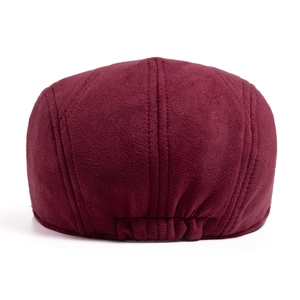 Close-up of suede beret back with elastic band and smooth stitching in burgundy red