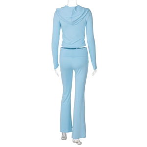 Rear view of light blue tracksuit featuring zip hoodie and flared pants on a mannequin