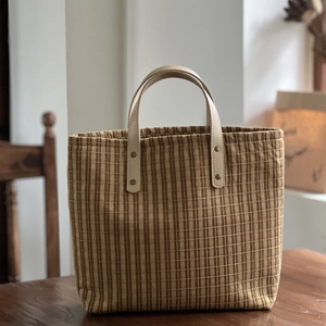 Retro plaid canvas tote bag with brown vertical stripes and premium leather handles