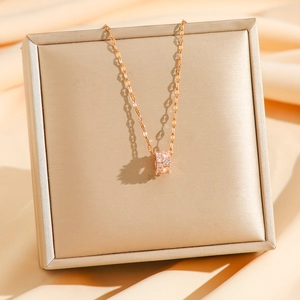 Pink and white zircon cylinder necklace in rose gold finish on a luxury gift box