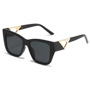 Fashionable square black frame sunglasses with cat-eye design and gold metal accents