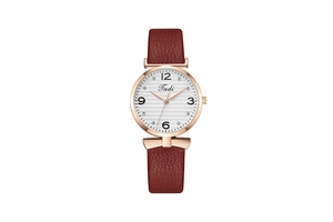 Detailed close-up of quartz watch dial with crystal indices and brown leather strap