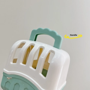 Detail view of the ergonomic portable handle and ventilation slats on the pet carrier toy