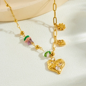 Gold-plated heart pendant necklace with colorful natural stone beads on stone base