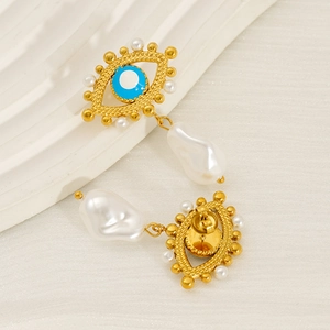 Elegant gold evil eye earrings with blue enamel detail and natural baroque pearl charms