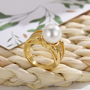 Elegant gold plated titanium steel ring featuring a large white pearl and zircon accents